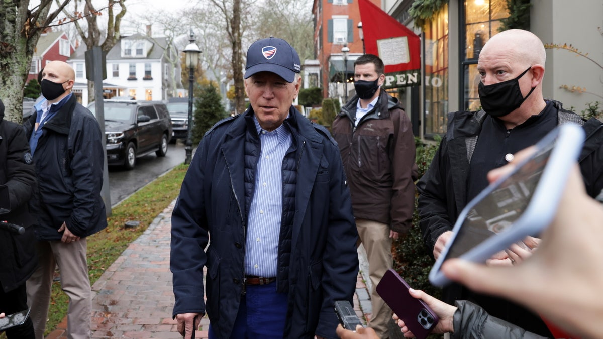 U.S. President Joe Biden speaks to the media before entering "Nantucket Bookworks" bookstore following lunch with family at the Nantucket Tap Room, in Nantucket island, Massachusetts, U.S, November 26, 2021. REUTERS/Tasos Katopodis