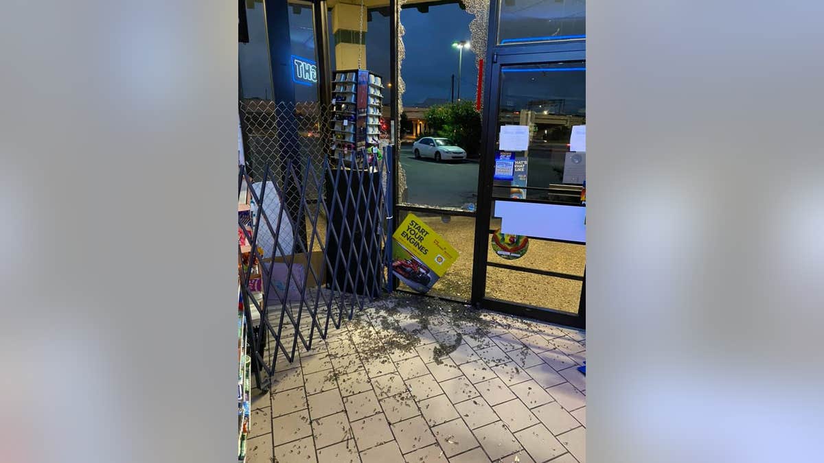 The convenience store's smashed windows after recent burglary