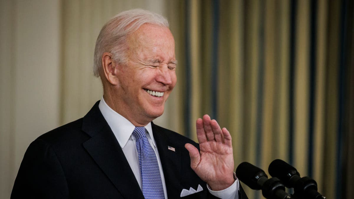 President Biden laughs