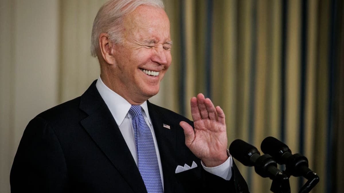 President Biden laughs