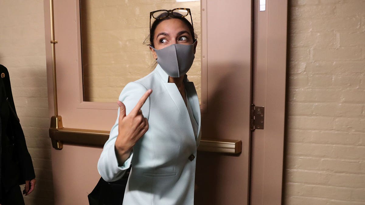 U.S. Rep. Alexandria Ocasio-Cortez, D-N.Y., departs after a meeting between U.S. President Joe Biden and Democratic lawmakers at the U.S. Capitol that Speaker of the House Nancy Pelosi hosted to promote Biden's bipartisan infrastructure bill on Capitol Hill in Washington, Oct. 1, 2021.