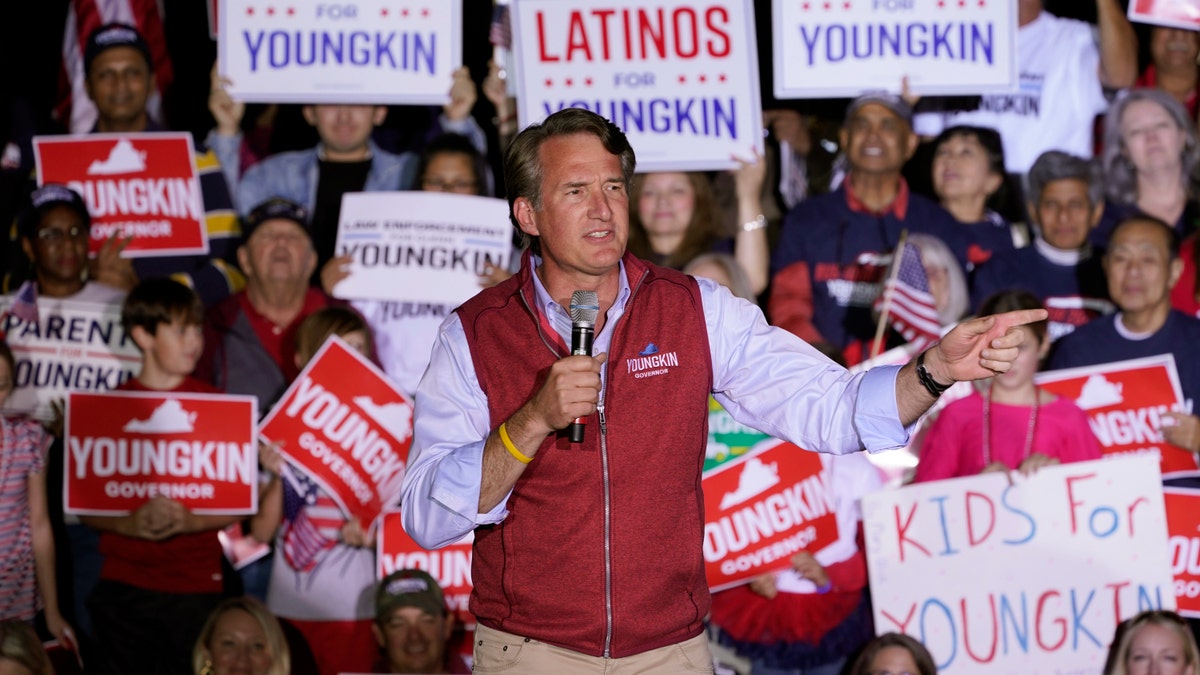 Republican gubernatorial candidate Glenn Youngkin gestures during a rally in Glen Allen, Va., Saturday, Oct. 23, 2021. Youngkin will face Democrat Terry McAuliffe in the November election. (AP Photo/Steve Helber)