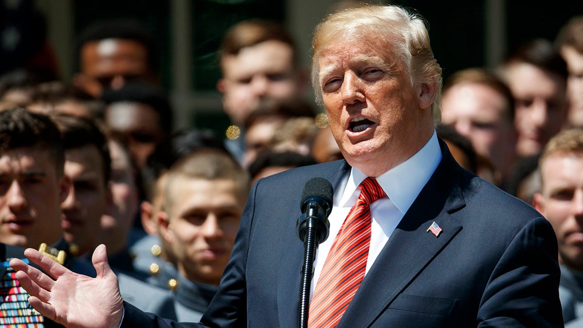 FILE - In this  Tuesday, May 1, 2018 file photo, President Donald Trump speaks during a ceremony to present the Commander in Chief trophy to the U.S. Military Academy football team in the Rose Garden of the White House in Washington. Democrat Terry McAuliffe has brought in the biggest names in Democratic politics to come to his aid in Virginia's hotly contested gubernatorial race: Obama, Harris, Abrams, Biden (both Joe and Jill). Republican Glenn Youngkin, meanwhile, is campaigning with ... Glenn Youngkin. (AP Photo/Evan Vucci, File)