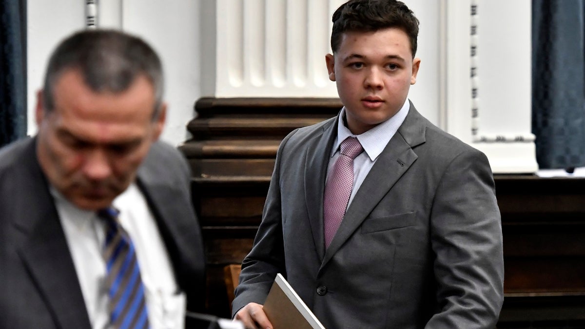 Kyle Rittenhouse walks into court for the start of jury selection on the first day of his trial in Kenosha, Wisconsin