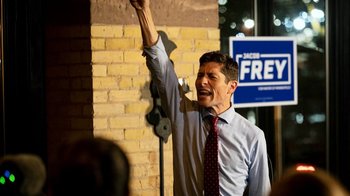 Mayor Jacob Frey throws his fist in the air as he speaks to supporters on Tuesday, Nov. 2, 2021 in Minneapolis. Minneapolis Mayor Jacob Frey risked his bid for a second term by opposing a push to replace the city's police department. Voters agreed with Frey on the policing question, but they left the mayor guessing until Wednesday about his own re-election..(AP Photo/Christian Monterrosa)