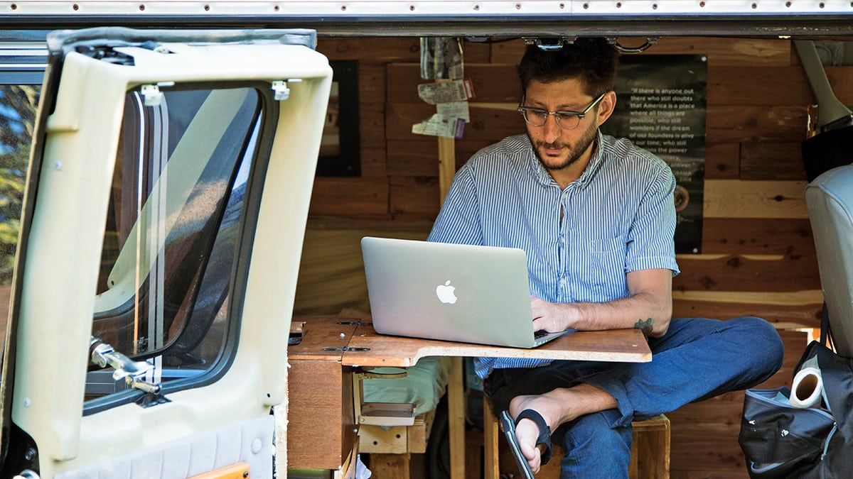 U.S. journalist Danny Fenster works out of his van that he made into a home/office in Detroit in this 2018 photo. (Fenster Family photo via AP, File)