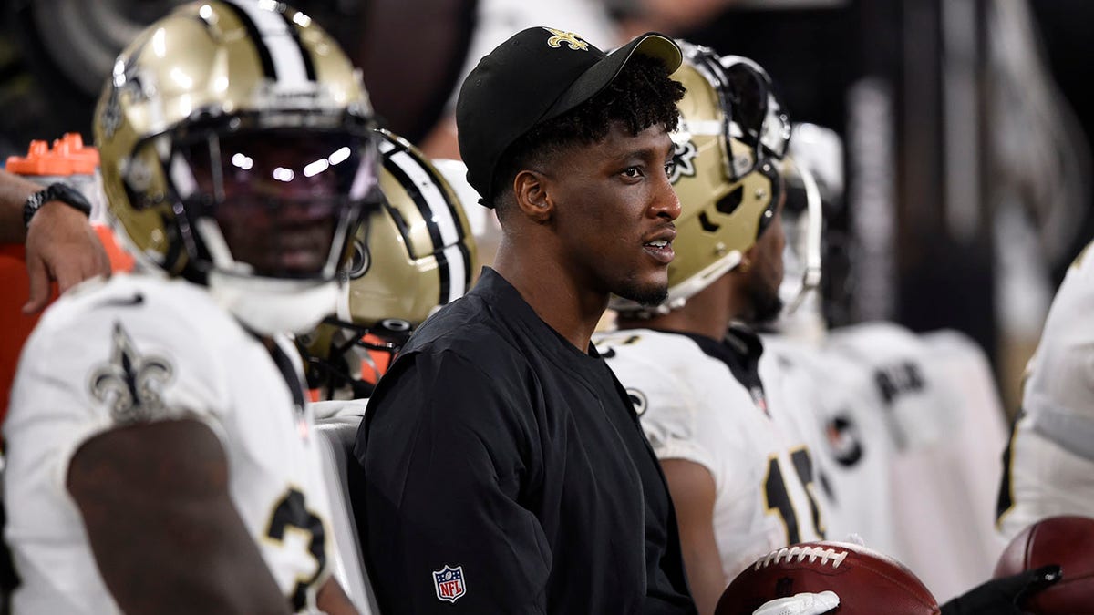 Michael Thomas watches from the sidelines