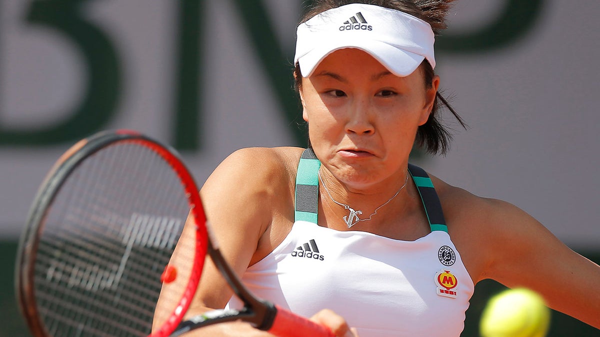 FILE: China's Shuai Peng plays a shot against Romania's Sorana Cirstea during their first round match of the French Open tennis tournament at the Roland Garros stadium, in Paris, France. Tuesday, May 30, 2017.