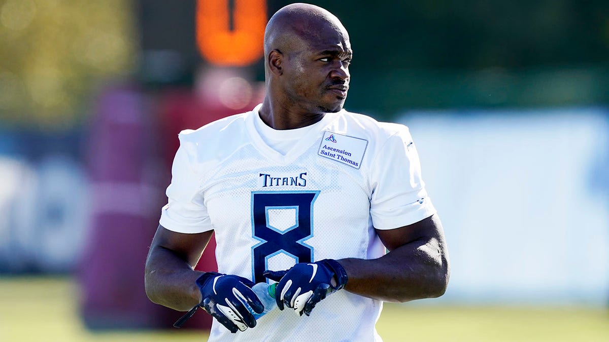 Tennessee Titans running back Adrian Peterson warms up during an NFL football practice Friday, Nov. 5, 2021, in Nashville, Tenn. The Titans signed 2012 NFL MVP and four-time All-Pro running back Peterson to help replace injured NFL rushing leader Derrick Henry. (AP Photo/Mark Humphrey)