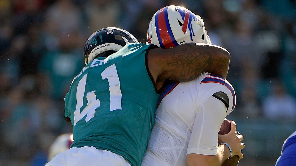 Jacksonville Jaguars linebacker Josh Allen (41) sacks Buffalo Bills quarterback Josh Allen, right, during the first half Sunday, Nov. 7, 2021, in Jacksonville, Fla.