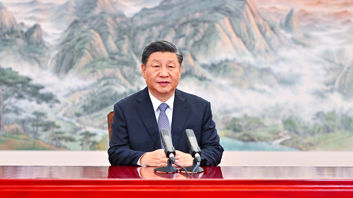 Chinese President Xi Jinping delivers a keynote speech for the Asia-Pacific Economic Cooperation (APEC) CEO Summit via video, from Beijing on Thursday, Nov. 11, 2021. (Li Xueren/Xinhua via AP)