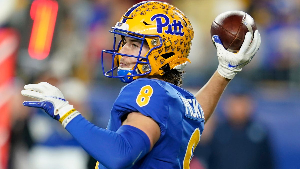 Pittsburgh quarterback Kenny Pickett throws a pass against North Carolina during the second half of an NCAA college football game Thursday, Nov. 11, 2021, in Pittsburgh. Pittsburgh won 30-23 in overtime. (AP Photo/Keith Srakocic)