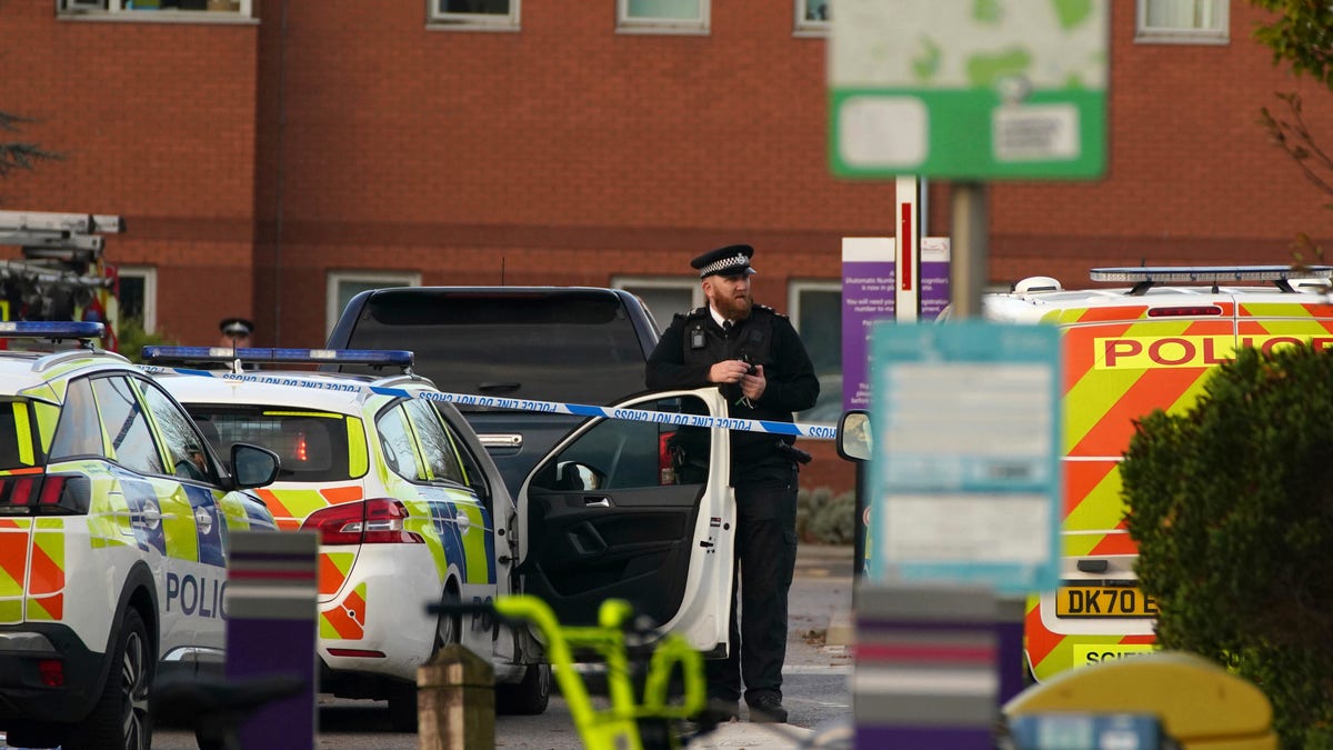 Emergency services outside Liverpool Women's Hospital in Liverpool, England, Sunday, Nov. 14, 2021. Counter-terrorism police in Britain are investigating an explosion at a hospital Sunday in the city of Liverpool that killed one person and injured another. Police were called to reports of a blast involving a taxi that pulled up at Liverpool Women’s Hospital shortly before the explosion took place Sunday morning. (Peter Byrne/PA via AP)