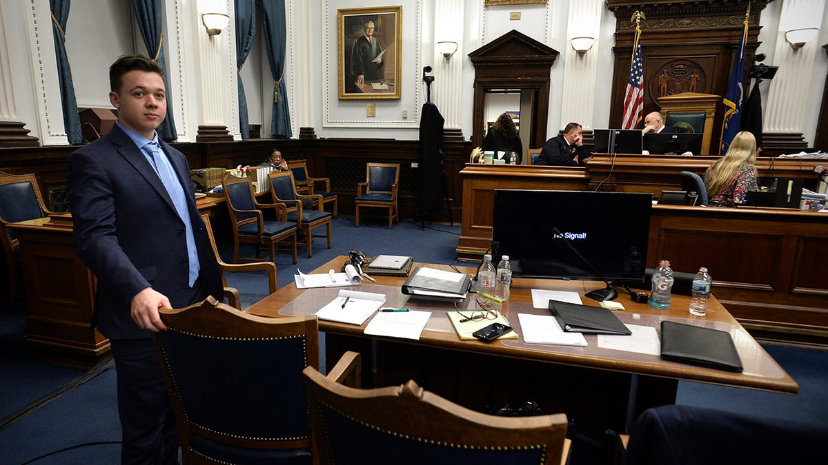 Kyle Rittenhouse waits near his table during a break in his trial at the Kenosha County Courthouse in Kenosha