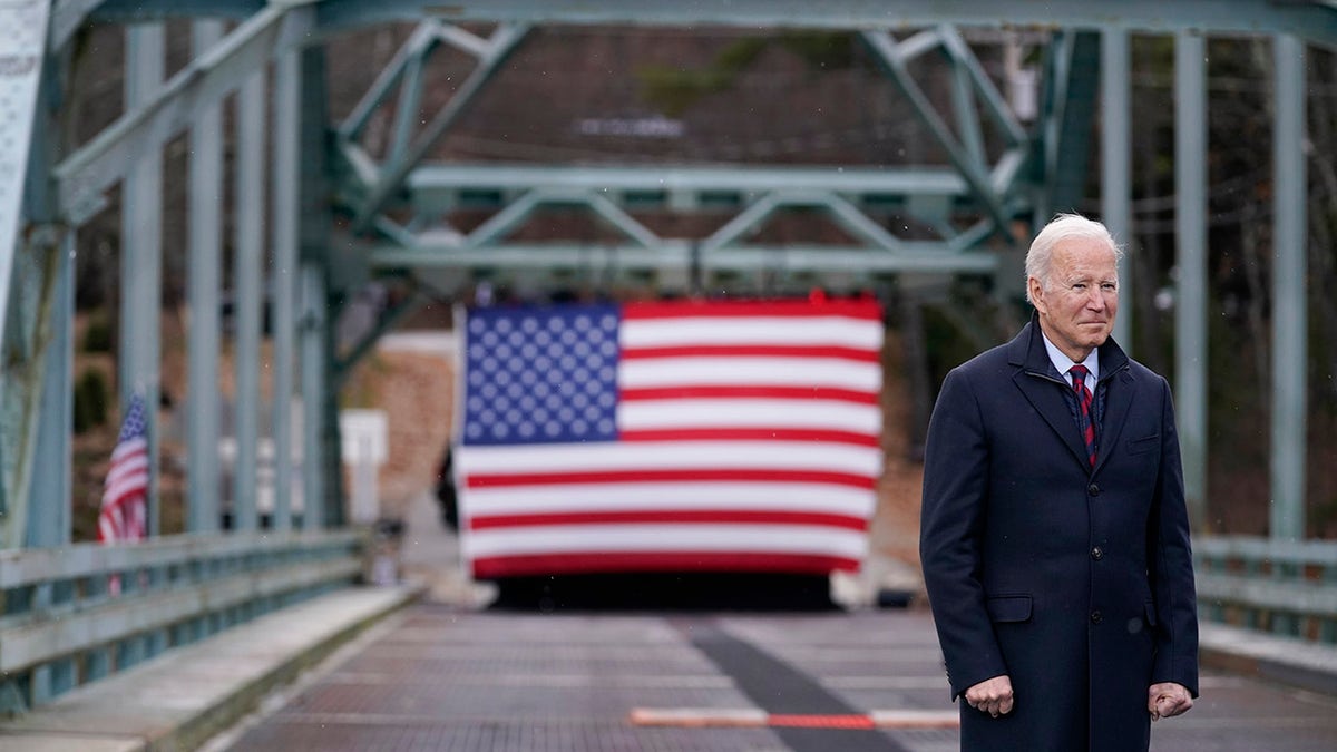 President Joe Biden waits to speak during a visit to the Green Bridge over the Pemigewasset River to promote infrastructure spending Tuesday, Nov. 16, 2021, in Woodstock, N.H. (Associated Press)
