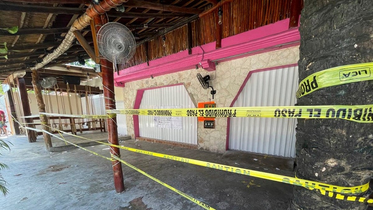 Police security tape covers the exterior of a restaurant the day after a shooting that killed two foreigners and wounded three others caught in the crossfire between drug dealers in Tulum Oct. 22. (AP Photo/Christian Rojas, File)