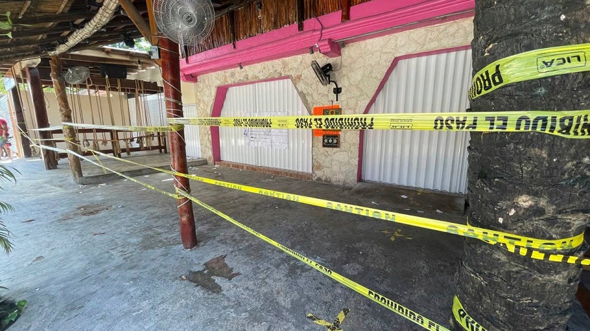 Police security tape covers the exterior of a restaurant the day after a shooting that killed two foreigners and wounded three others caught in the crossfire between drug dealers in Tulum Oct. 22. (AP Photo/Christian Rojas, File)