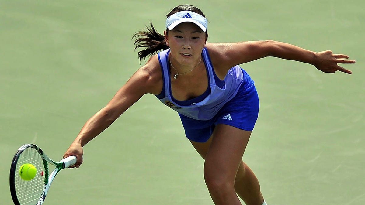 Peng Shuai of China returns a ball during the semifinal match against Shahar Peer of Israel, unseen, in the Guangzhou WTA Tour in Guangzhou in south China's Guangdong province Saturday, Sept. 19, 2009. 