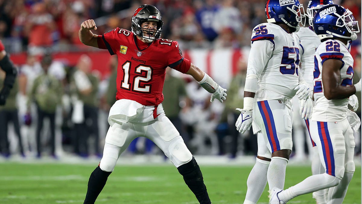 Tampa Bay Buccaneers quarterback Tom Brady (12) reacts to his first down run against the New York Giants during the first half of an NFL football game Monday, Nov. 22, 2021, in Tampa, Florida.