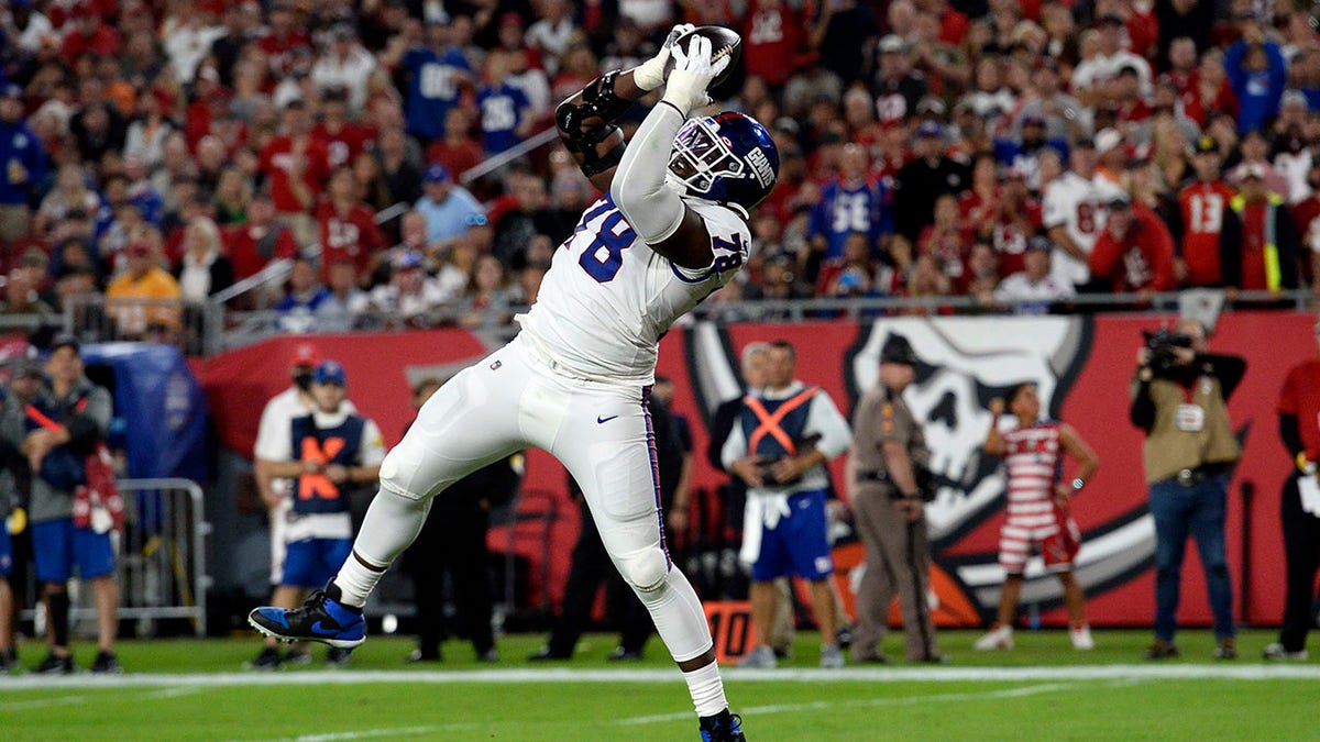 New York Giants' Andrew Thomas scores on a 2-yard touchdown pass against the Buccaneers on Monday, Nov. 22, 2021, in Tampa, Florida.