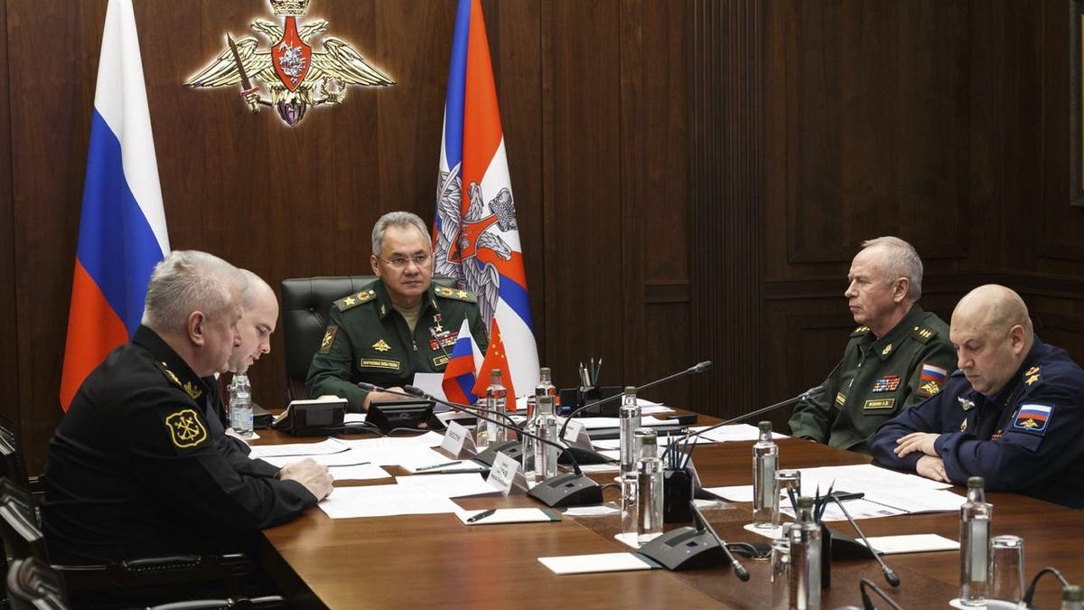 In this photo released by the Russian Defense Ministry Press Service, Russian Defense Minister Sergei Shoigu, center, takes part in a video call with his Chinese counterpart Wei Fenghe in Moscow, Russia, Tuesday, Nov. 23, 2021. Shoigu and Wei signed a roadmap for military cooperation between Moscow and Beijing and called for intensifying joint drills and patrols. (Vadim Savitskiy/Russian Defense Ministry Press Service via AP)