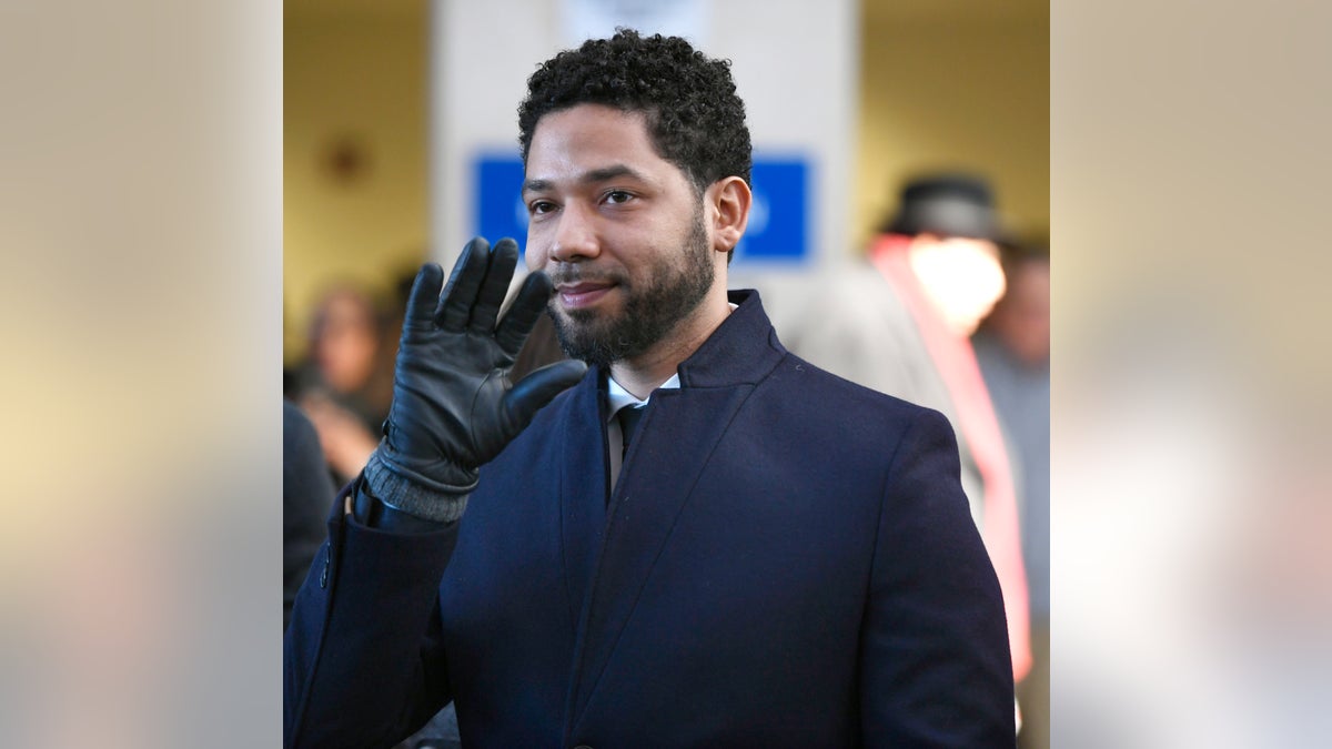 FILE - Actor Jussie Smollett smiles and waves to supporters before leaving Cook County Court after his charges were dropped Tuesday, March 26, 2019, in Chicago. Smollett is going on trial this week, accused of lying to police when he reported he was the victim of a racist, homophobic attack downtown Chicago nearly three years ago. Jury selection is scheduled for Monday, Nov. 29, 2021. (AP Photo/Paul Beaty, File)