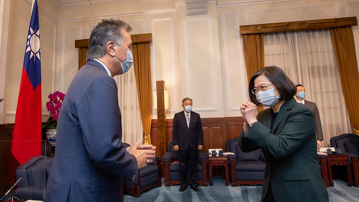 U.S. Rep. Mark Takano, D-Calif., left, is greeted by Taiwanese President Tsai Ing-wen at the Presidential Office in Taipei, Taiwan on Friday. Five U.S. lawmakers met with Tsai in a surprise one-day visit intended to reaffirm America's "rock solid" support for the self-governing island. 
