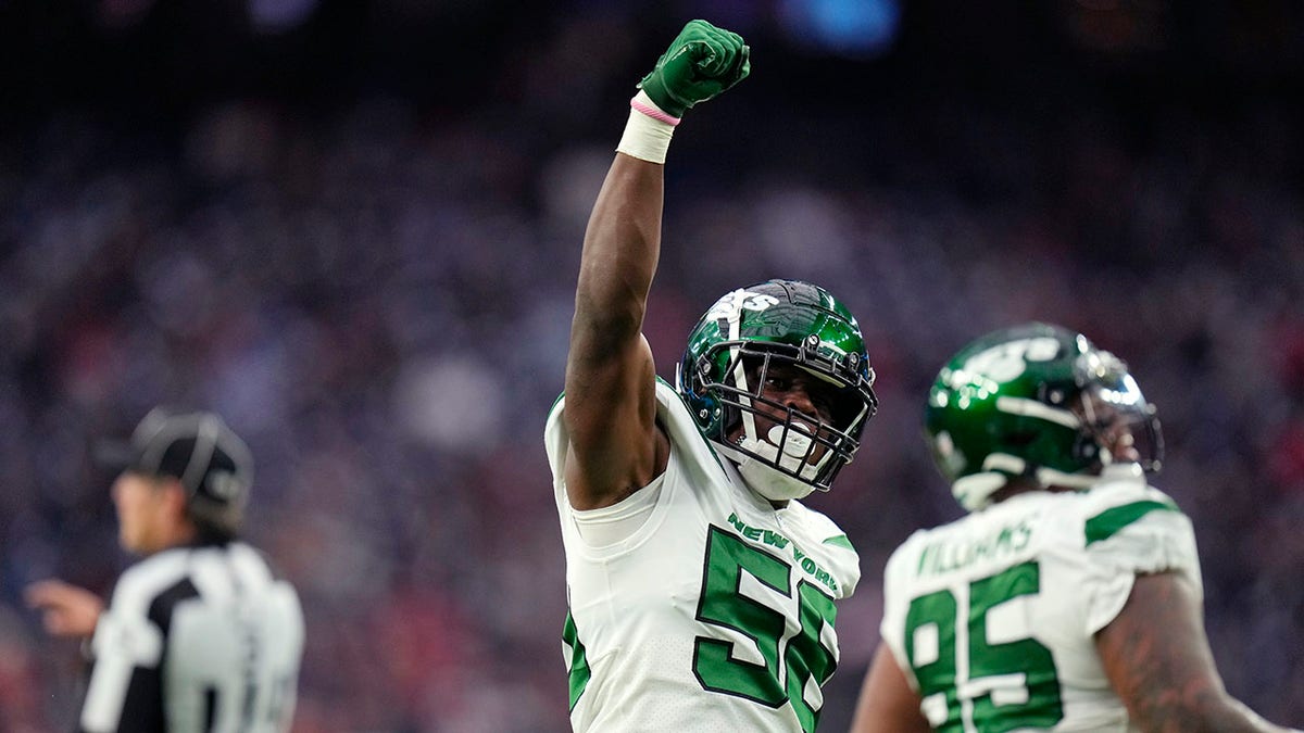 New York Jets outside linebacker Quincy Williams (56) celebrates a sack in the first half against the New York Jets in Houston, Sunday, Nov. 28, 2021.
