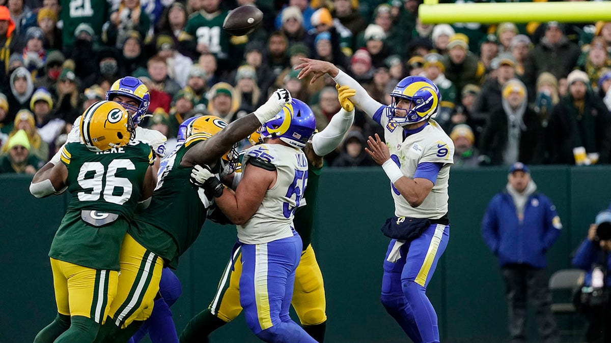 The Los Angeles Rams' Matthew Stafford throws during the first half of a game against the Green Bay Packers Sunday, Nov. 28, 2021, in Green Bay, Wis.