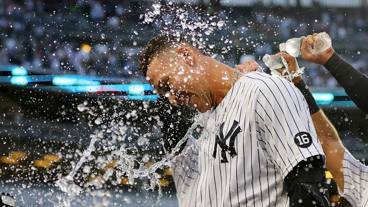 Aaron Judge #99 of the New York Yankees celebrates after hitting a walk-off single in the bottom of the ninth inning to beat the Tampa Bay Rays 1-0 at Yankee Stadium on October 03, 2021 in New York City.