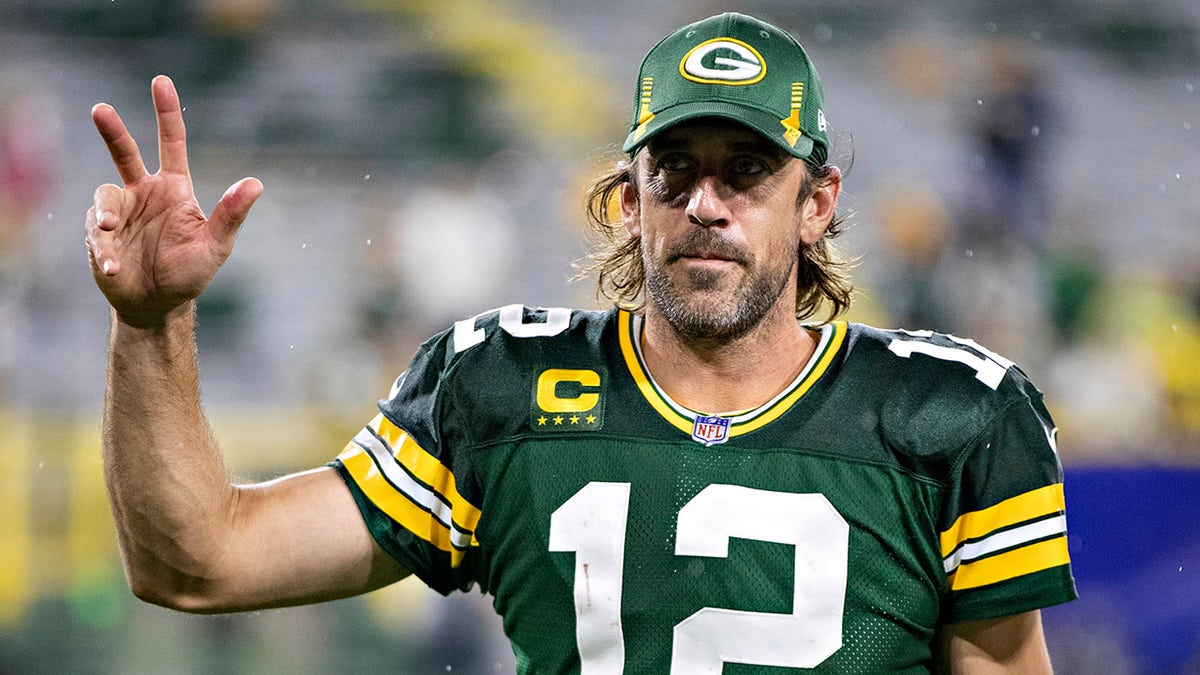 Aaron Rodgers signals to fans after a game against the Detroit Lions at Lambeau Field on Sept. 20, 2021, in Green Bay, Wisconsin.