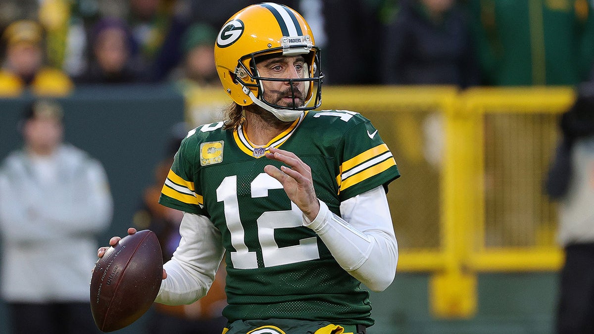 GREEN BAY, WISCONSIN - NOVEMBER 14: Aaron Rodgers #12 of the Green Bay Packers looks to pass the ball during the first quarter against the Seattle Seahawks at Lambeau Field on November 14, 2021 in Green Bay, Wisconsin.