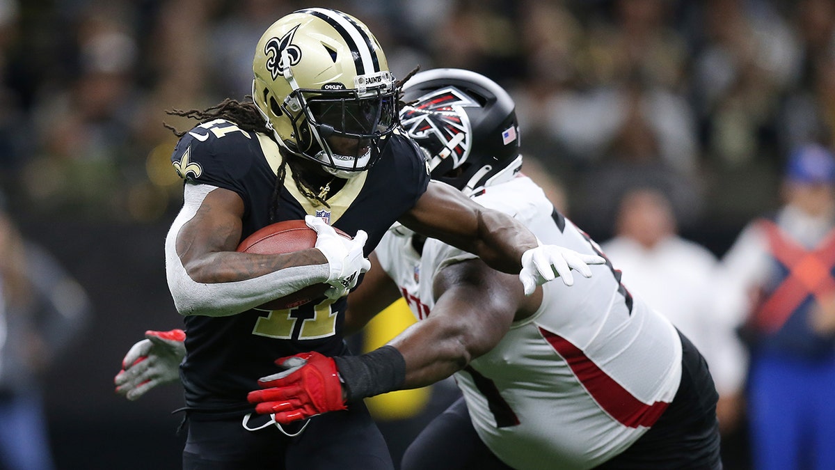 Alvin Kamara (41) of the New Orleans Saints runs the ball during the fourth quarter in the game against the Atlanta Falcons at Caesars Superdome on Nov. 7, 2021, in New Orleans, Louisiana.