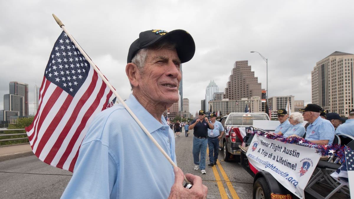 Joe Barger of Austin waits during the Veteran's Day parade up Congress Avenue and ceremony at the Texas Capitol. Several thousand Texans lined Congress Avenue to witness military heroes, marching bands and floats in the annual parade. (Photo by Robert Daemmrich Photography Inc/Corbis via Getty Images)