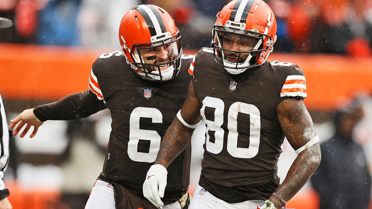 Cleveland Browns quarterback Baker Mayfield (6) congratulates wide receiver Jarvis Landry (80) after Landry scored a 16-yard touchdown during the first half of an NFL football game against the Detroit Lions, Sunday, Nov. 21, 2021, in Cleveland.