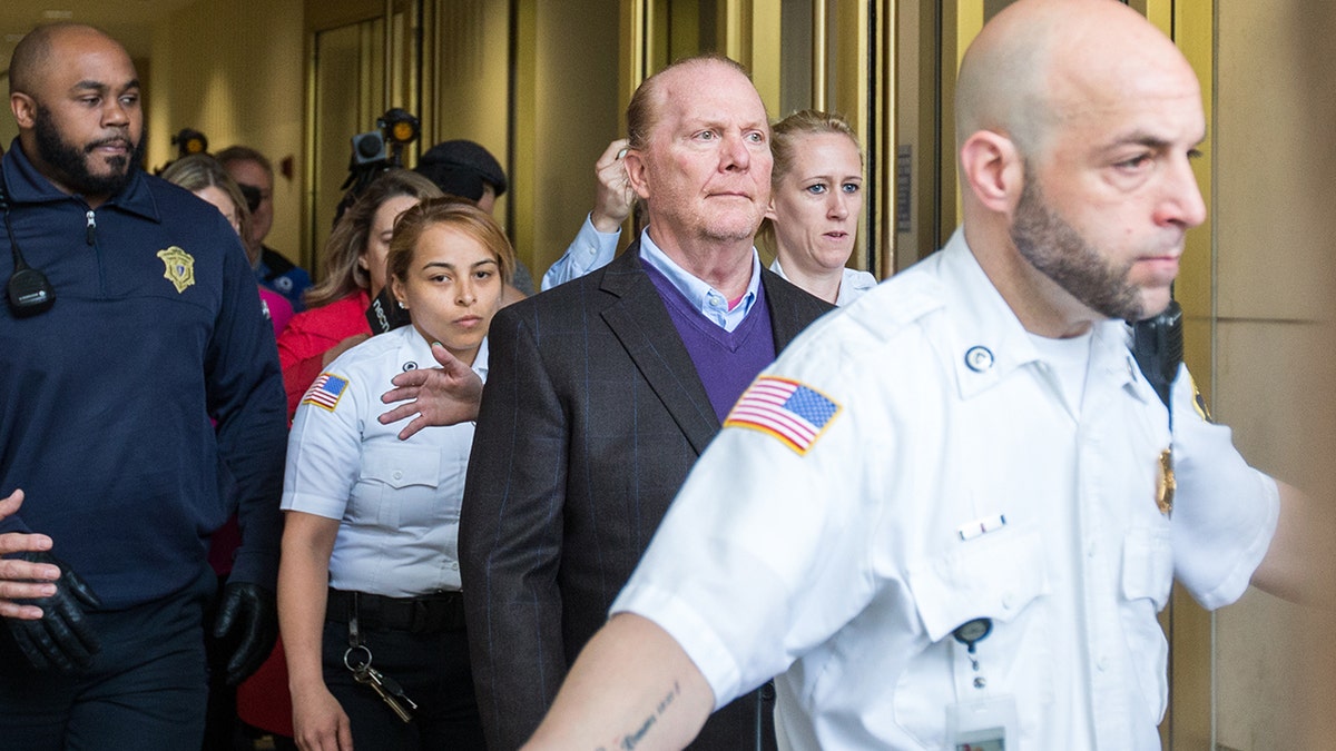 Celebrity chef Mario Batali leaves Boston Municipal Court following an arraignment on a charge of indecent assault and battery in connection with a 2017 incident at a Back Bay restaurant on May 24, 2019, in Boston, Massachusetts.  