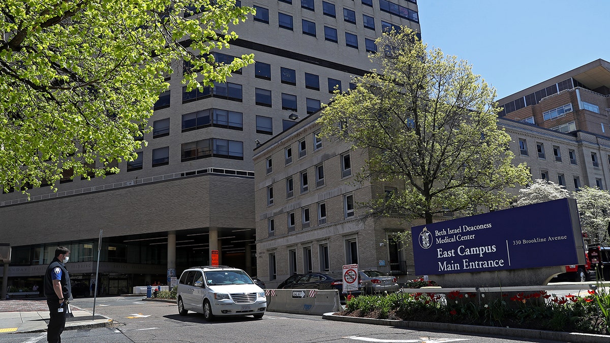This photo shows medical workers near the East Campus main entrance of Beth Israel Deaconess Medical Center, a Harvard teaching hospital, in Boston on May 14, 2020. The hospital reported that 18% of adults with hypertension reported that they took medication that may increase blood pressure.