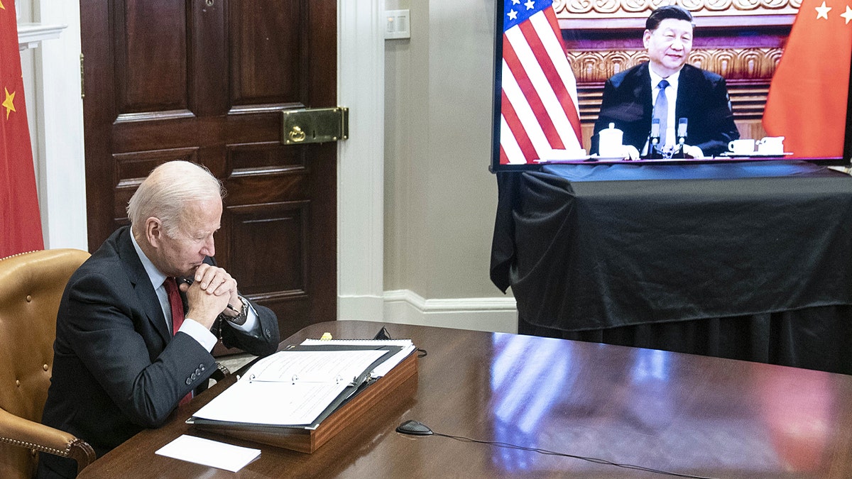 Biden listens during a meeting with China President 