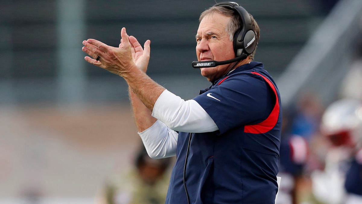 New England Patriots head coach Bill Belichick applauds toward his players on the field during the second half of an NFL football game against the Cleveland Browns, Sunday, Nov. 14, 2021, in Foxborough, Massachusetts.