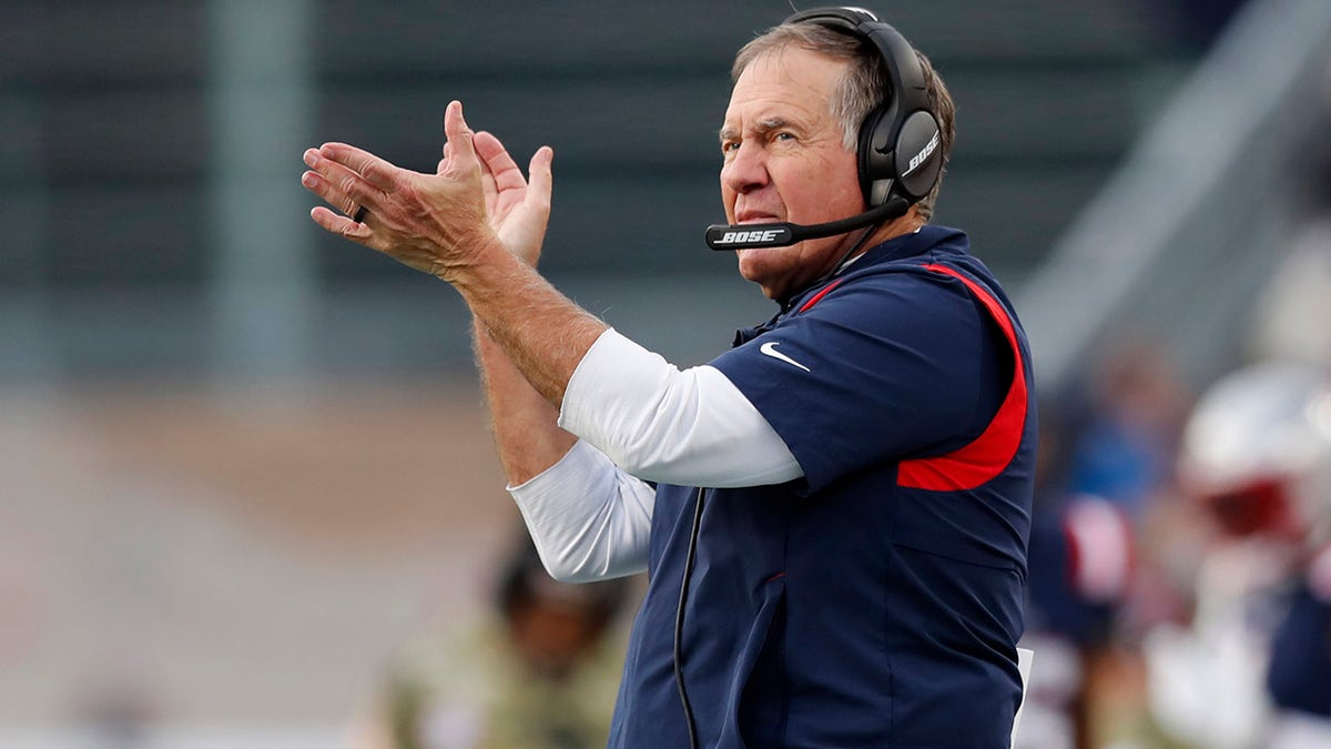 New England Patriots head coach Bill Belichick applauds towards his players on the field during the second half of an NFL football game against the Cleveland Browns, Sunday, Nov. 14, 2021, in Foxborough, Massachusetts.