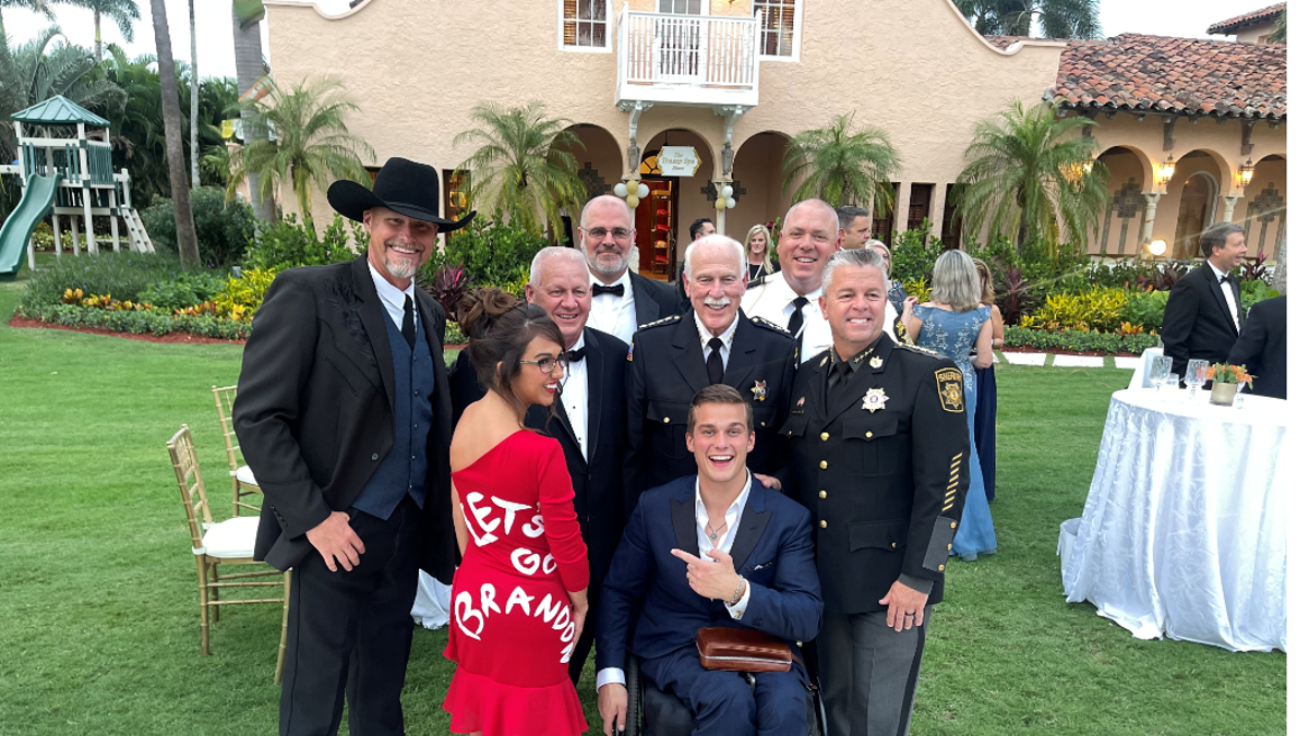 Rep. Lauren Boebert, R-Colo., and Rep. Madison Cawthorn, R-N.C., pose with others at Mar-a-Lago in Palm Beach, Florida.