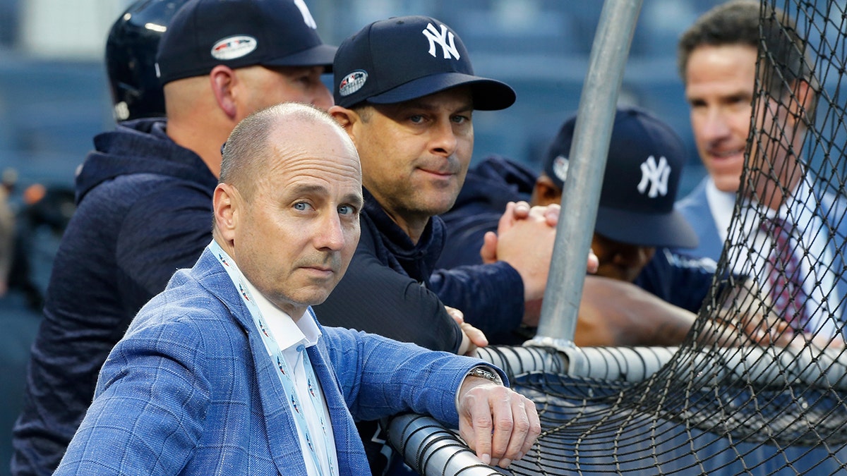 General manager Brian Cashman and manager Aaron Boone of the New York Yankees during batting practice before Game Four of the American League Division Series against the Boston Red Sox at Yankee Stadium on Oct. 9, 2018, in the Bronx borough of New York City.