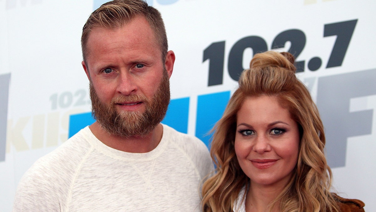 Candace Cameron Bure and her husband at an event