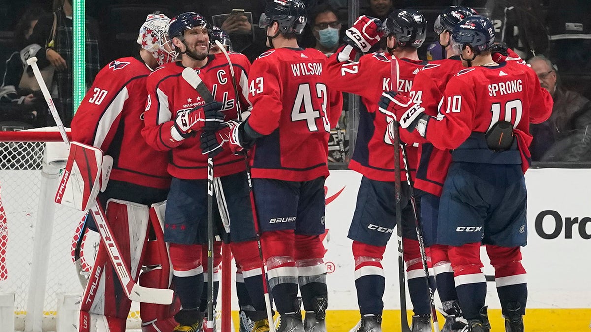 Washington Capitals celebrate a 2-0 win over the Los Angeles Kings after their NHL hockey game Wednesday, Nov. 17, 2021, in Los Angeles. 