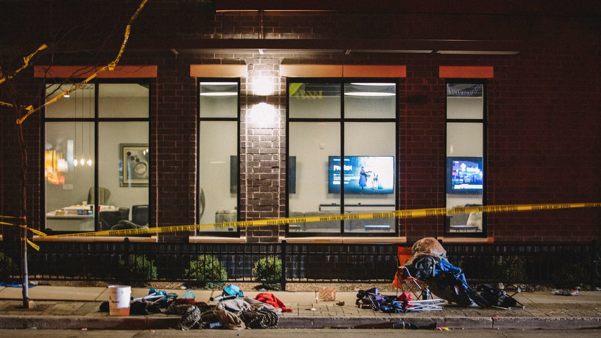 photo shows chairs and jackets left behind by spectators