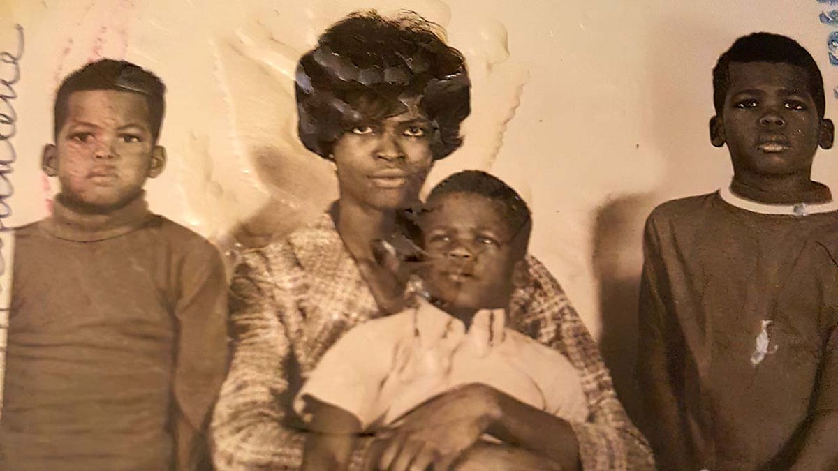 Clarence, mom Ruth holding Cecil, and Charles Payne