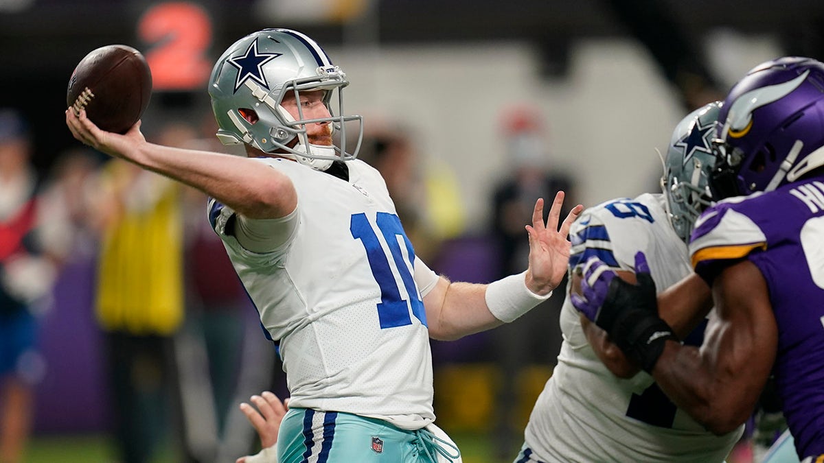 Dallas Cowboys quarterback Cooper Rush (10) hands the ball off