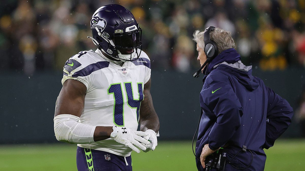 DK Metcalf #14 of the Seattle Seahawks is ejected from the game following an altercation during a game against the Green Bay Packers at Lambeau Field on November 14, 2021 in Green Bay, Wisconsin.  The Packers defeated the Seahawks 17-0. 