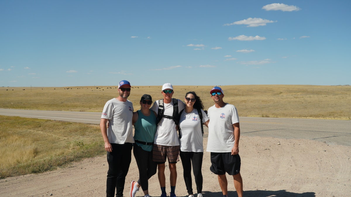 Team American Runner, U.S. Air Force veteran Jordan Moon's support and logistics team, assists him on a cross-country trek from San Francisco to New York City. November 11, 2021.