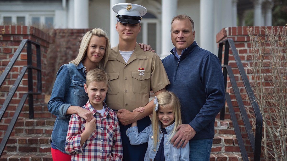 Cpl. Daegan Page, center, with his family.